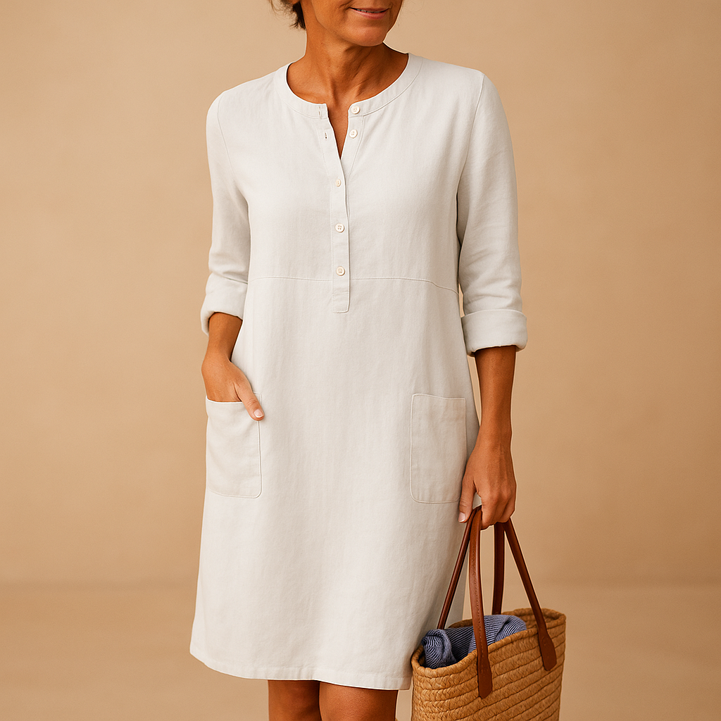 Relaxed long casual dress for women with button front, rolled sleeves, and side pockets, ideal for everyday comfort and weekend wear.