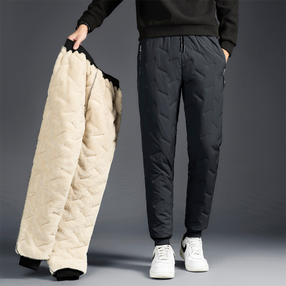 Women's thermal waterproof fleece-lined trousers, black, fleece interior, zippered pockets, ideal winter outdoor wear.