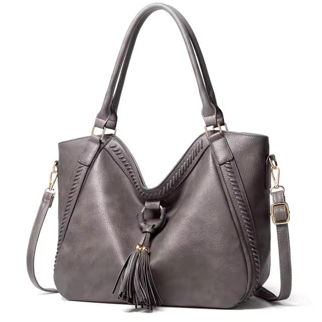 Classic Leather Handbag with Chic Tassel Trim