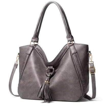 Classic Leather Handbag with Chic Tassel Trim