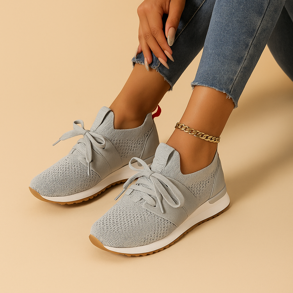 Women’s lace-up shoes with breathable mesh, cushioned rubber sole, and rounded toe in black, grey, brown, and red, ideal for daily comfort.