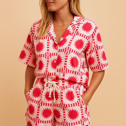 Women’s floral summer set with short-sleeve blouse and elastic waistband shorts, available in beige, blue, light green, and yellow, ideal for warm weather
