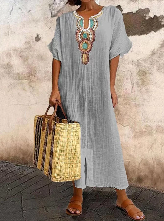 Airy cotton kaftan dress with ethnic accents, featuring a loose fit and chic bohemian style for summer wear.