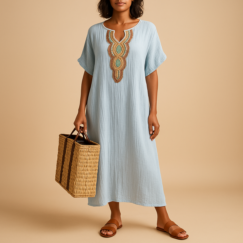 Women’s kaftan dress with airy fabric and flowing silhouette, perfect for summer beach outings or elegant occasions.