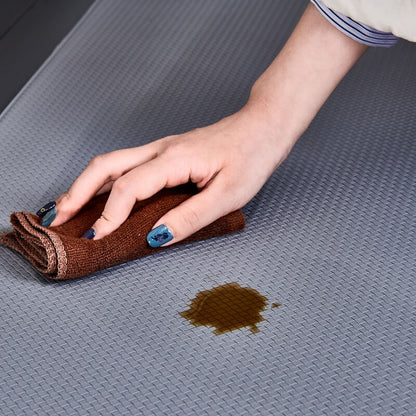 "Anti-slip waterproof kitchen rug with comfort cushioning, durable PVC, two-sided no-slip design, in grey rhombus pattern."