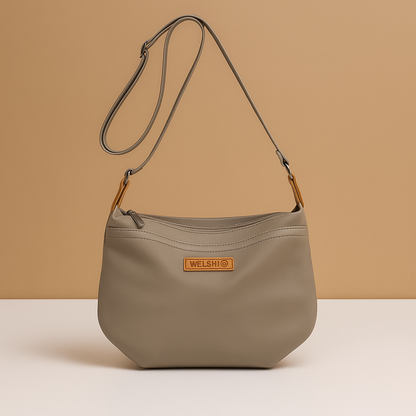 Waterproof anti-theft crossbody travel bag for women with wide strap, secure zip, and functional compartments for commuting or travel.