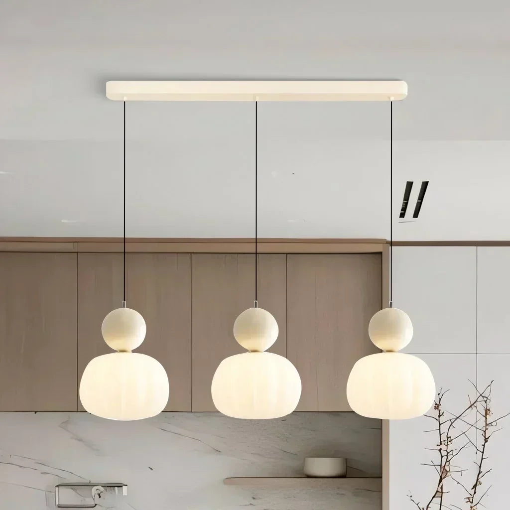 "Art Deco Cream Pendant Light with Bauhaus design, features high-quality metal frame and warm glow for elegant home lighting.