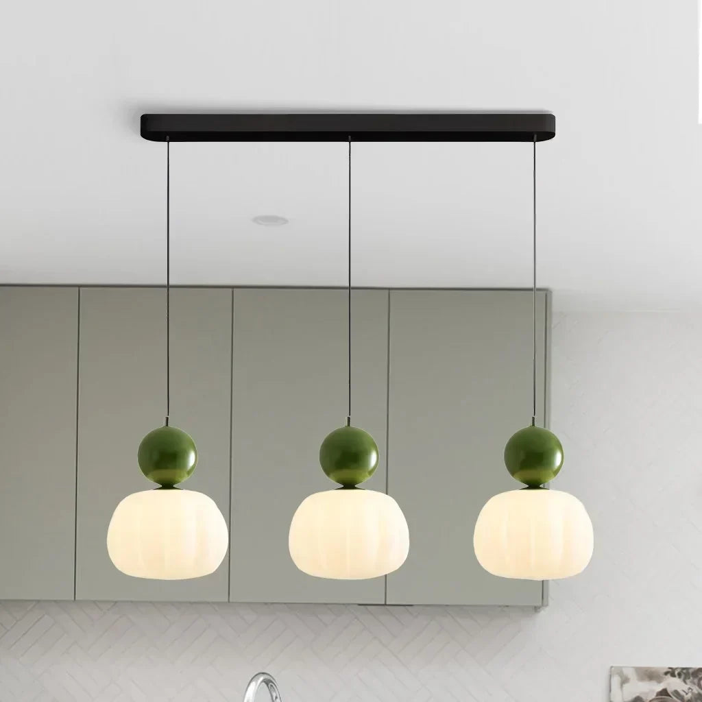 "Art Deco Cream Pendant Light with Bauhaus design, features high-quality metal frame and warm glow for elegant home lighting.