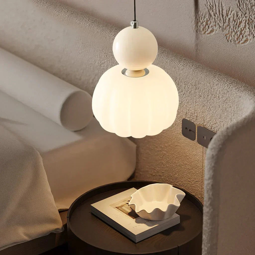 "Art Deco Cream Pendant Light with Bauhaus design, features high-quality metal frame and warm glow for elegant home lighting.