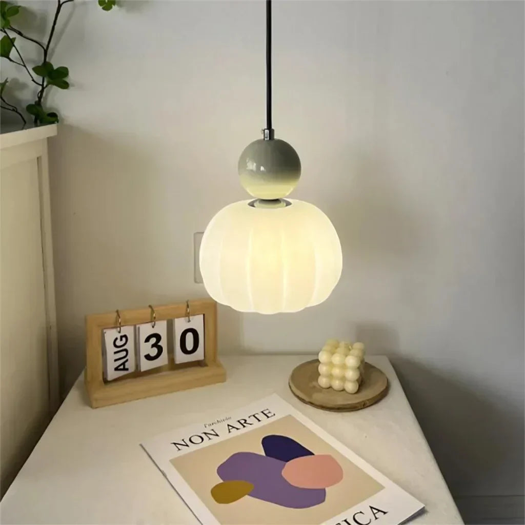 "Art Deco Cream Pendant Light with Bauhaus design, features high-quality metal frame and warm glow for elegant home lighting.