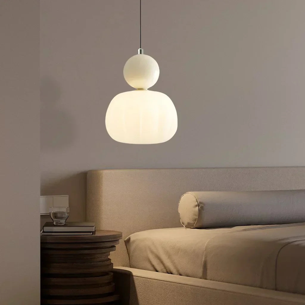 "Art Deco Cream Pendant Light with Bauhaus design, features high-quality metal frame and warm glow for elegant home lighting.