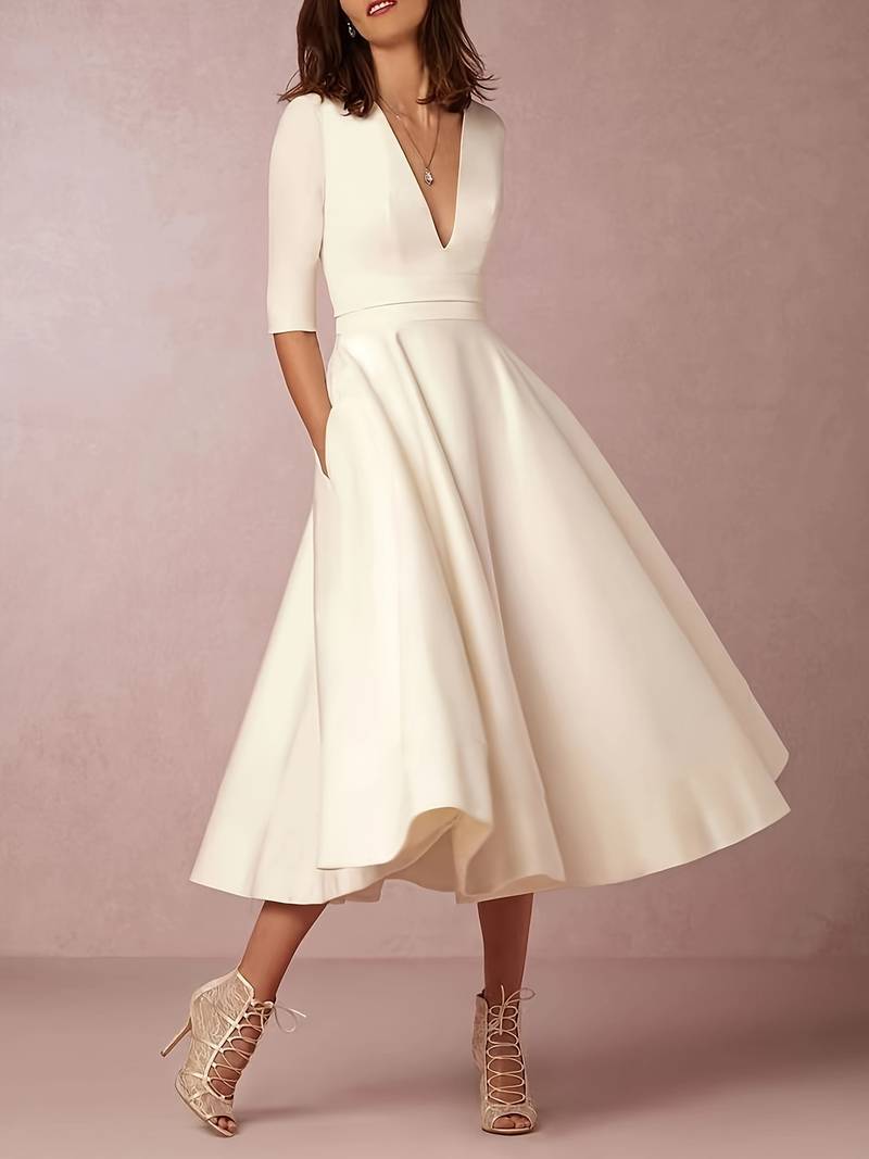 "Black A-Line V-Neck Short Sleeve Mini Dress for Spring/Summer, women's flattering silhouette, breezy and elegant style."