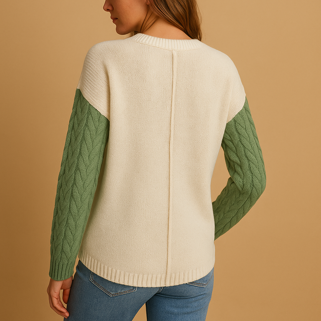 Women’s cable knit sweater with drop shoulders and a pocket detail, perfect for casual layering and everyday comfort.