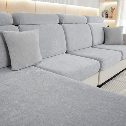 "Chenille sectional sofa cover in smoke color, fits snugly on sectional sofas to protect against wear, spills, and stains."
