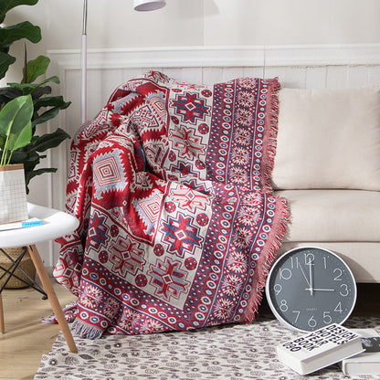 "Colorful bohemian tassel knitted sofa throw, featuring bright patterns and ethnic tassel details for vibrant home decor."