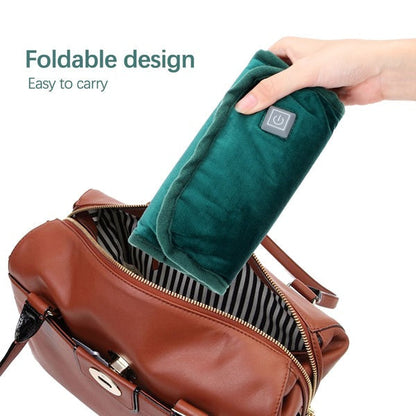 "Compact 2-in-1 Electric Hand Warmer with USB Charging, plush exterior, foldable design, ideal for travel and chilly days."