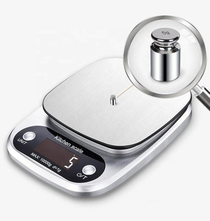"Compact stainless steel kitchen scale with sleek design for precise 0.1g measurements, ideal for culinary accuracy."