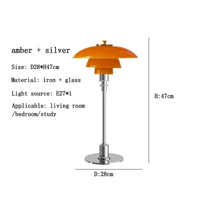 Contemporary Danish designer table lamp with warm LED light, sleek Scandinavian form, amber finish, and premium glass.
