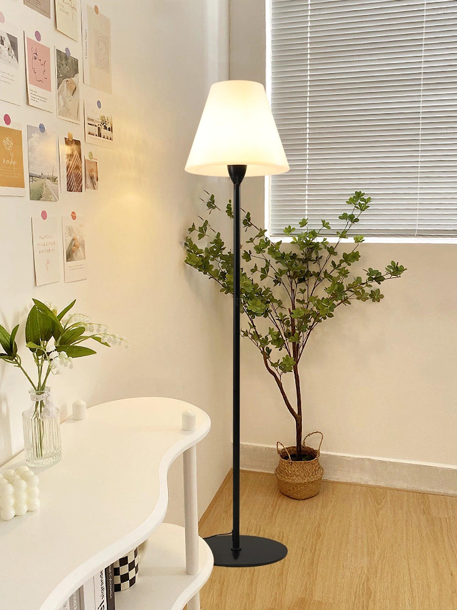 "Contemporary metal and acrylic floor-standing lamp with sleek lines, modern flair, perfect for home decor lighting."