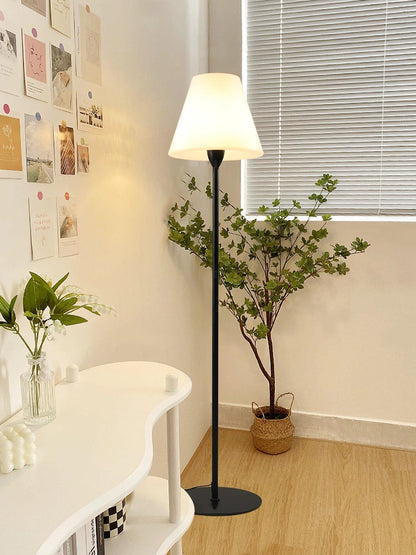 "Contemporary metal and acrylic floor-standing lamp with sleek lines, modern flair, perfect for home decor lighting."