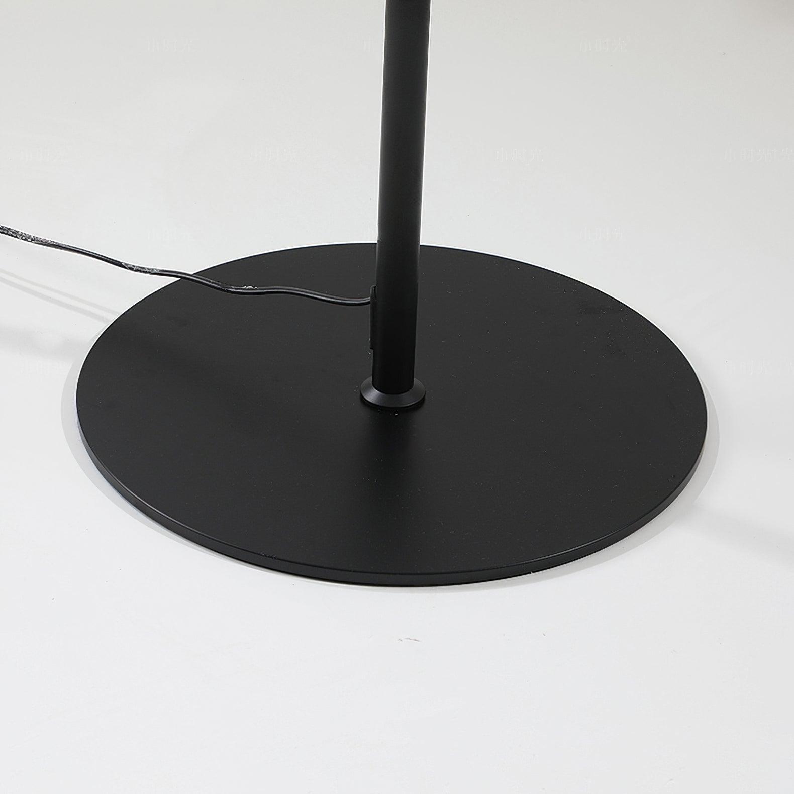 "Contemporary metal and acrylic floor-standing lamp with sleek lines, modern flair, perfect for home decor lighting."