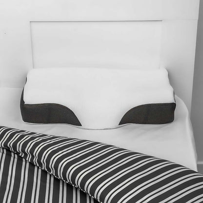 "Contoured memory foam neck pillow for pain relief, featuring spinal alignment support; ideal for better sleep."