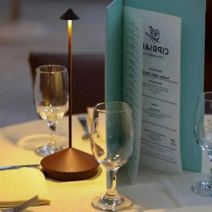 "Cordless rechargeable table lamp, sleek pine-like design, touch control, USB-powered, waterproof, dimmable LED lighting."