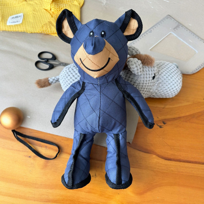 "Durable plush dog teddy in soft beige fabric, ideal for pet playtime and comfort. Perfect for chewing and cuddling."