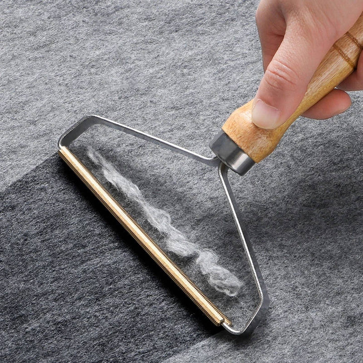 Eco-friendly lint remover with sturdy metal bristles, ideal for removing pet hair and lint from clothes, sofa, furniture.