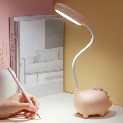 Eco-friendly T-Rex LED desk light for kids; whimsical dino shape, adjustable neck, soft eye-caring light; available in yellow
