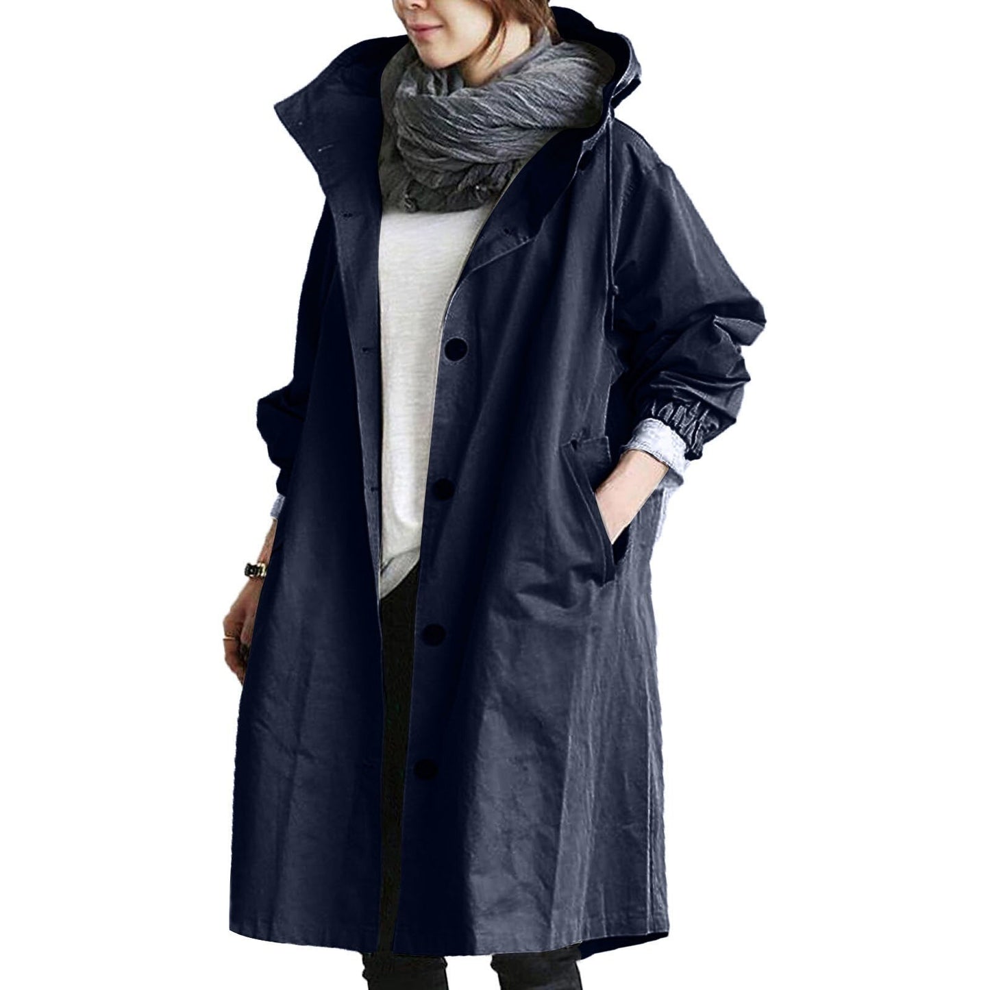 Elegant beige long waterproof raincoat for women with adjustable hood and pockets, provides style and protection in rain.