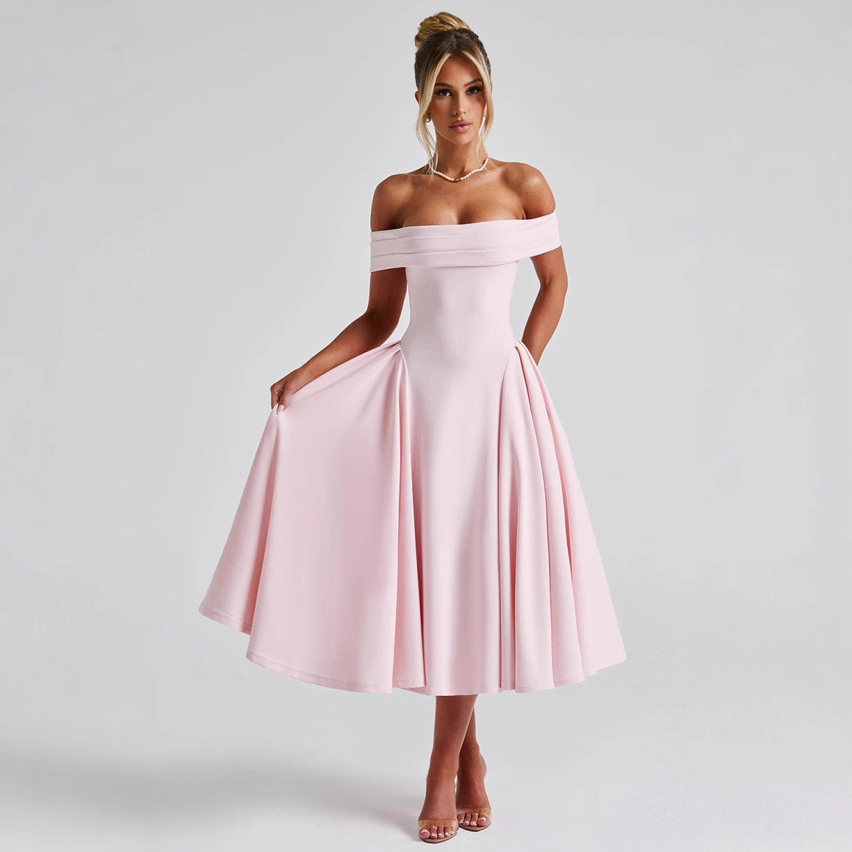 Elegant off-shoulder A-line midi dress in classic colors, designed to highlight graceful silhouettes for formal events.