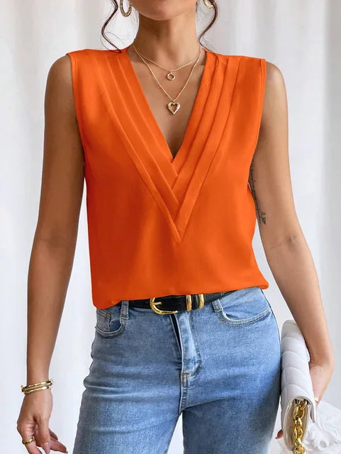 Elegant sleeveless pleated summer blouse for women, loose fit, versatile styling, chic casual or office wear.