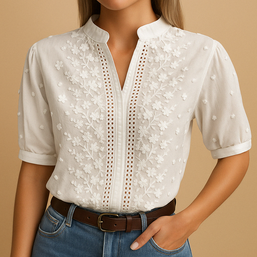 Elegant white blouse for women with classic collar and button closure, perfect for workwear or casual occasions.