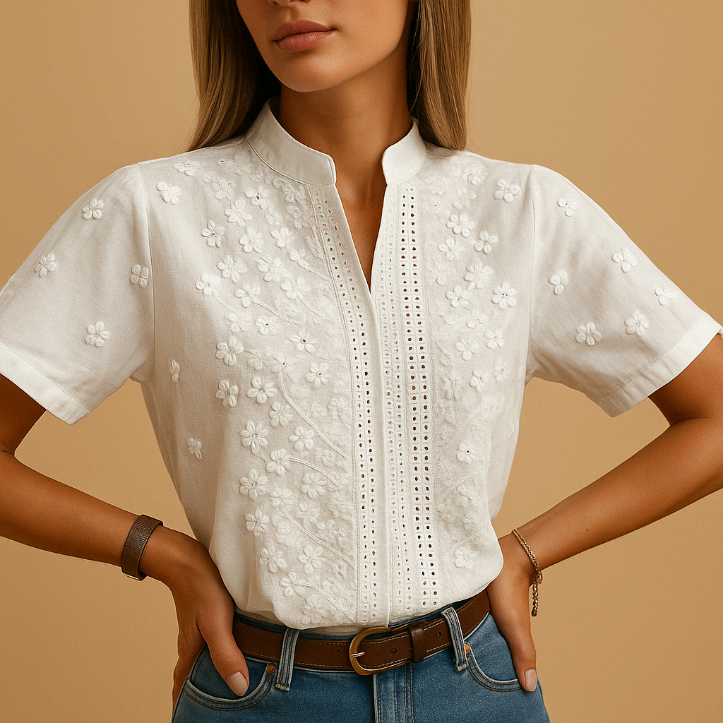 Elegant white blouse for women with classic collar and button closure, perfect for workwear or casual occasions.