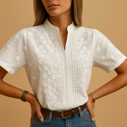 Elegant white blouse for women with classic collar and button closure, perfect for workwear or casual occasions.