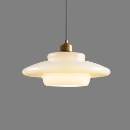 Elegant white glass pendant light with brass fixture, mid-century design, perfect for modern or classic interiors, adds luxur