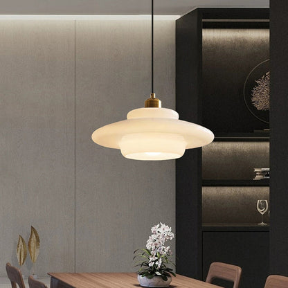 Elegant white glass pendant light with brass fixture, mid-century design, perfect for modern or classic interiors, adds luxur