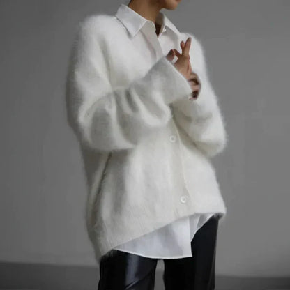 "Elegant women's cashmere cardigan in soft grey, showcasing a luxurious knit texture for ultimate softness and comfort."