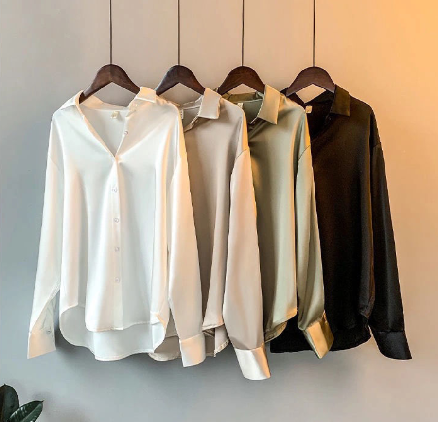 Elegant women's fall blouse in luxurious silk, soft and classic design, perfect for versatile styles and chic silhouettes.