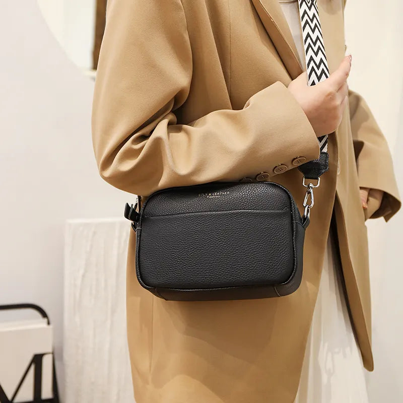 Elegant women's leather crossbody bag with adjustable strap, pebbled texture, ideal for casual or formal occasions.