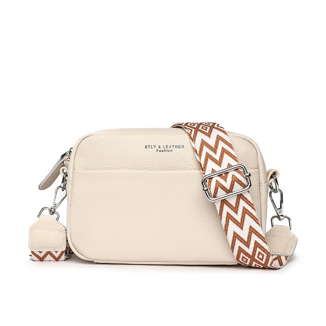 Elegant women's leather crossbody bag with adjustable strap, pebbled texture, ideal for casual or formal occasions.