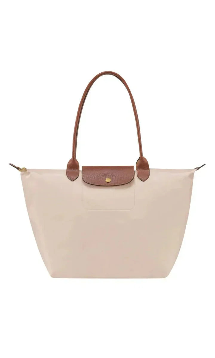 Elegant women's shoulder bag with adjustable straps, spacious interior, chic design for style and functionality.