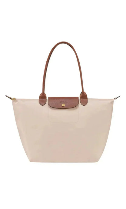 Elegant women's shoulder bag with adjustable straps, spacious interior, chic design for style and functionality.