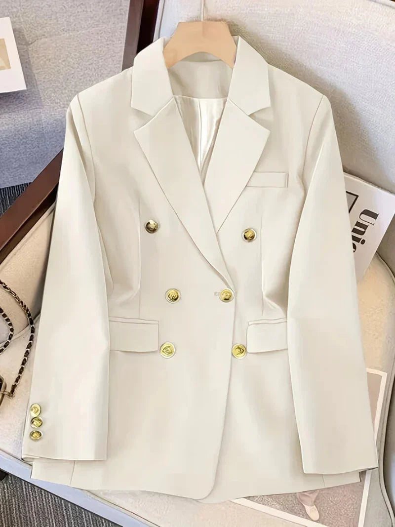 Elegant women's slim blazer with golden buttons, hip-length, long sleeves, in apricot, black, or camel, enhances style.