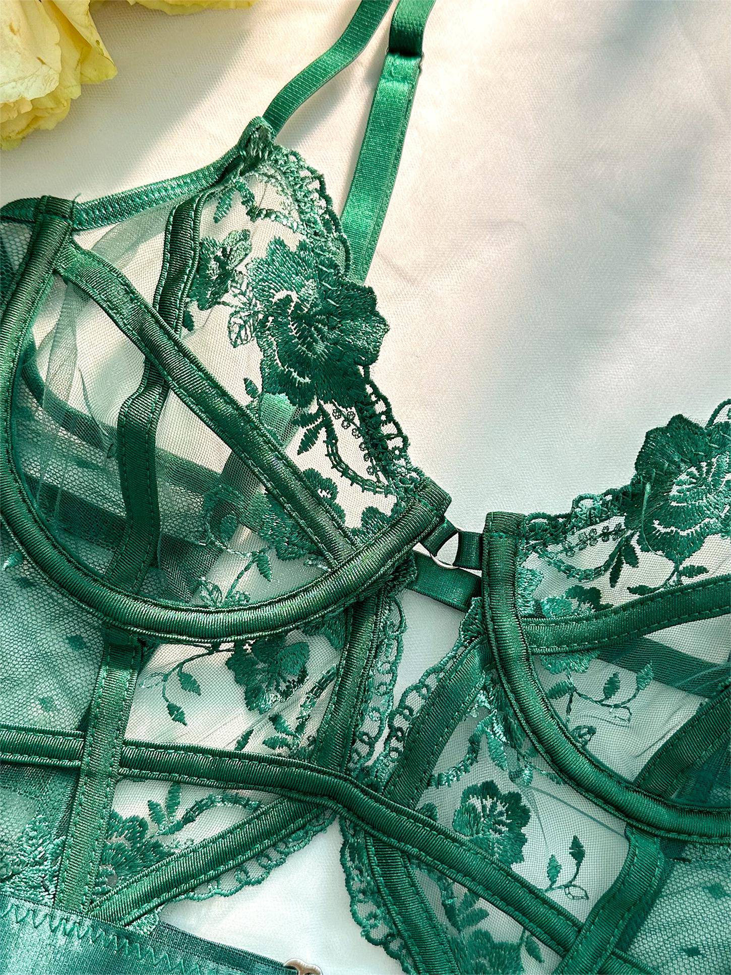 Emerald lace bodysuit for women with underwire support, featuring vibrant green lace, adjustable straps, and secure back clos