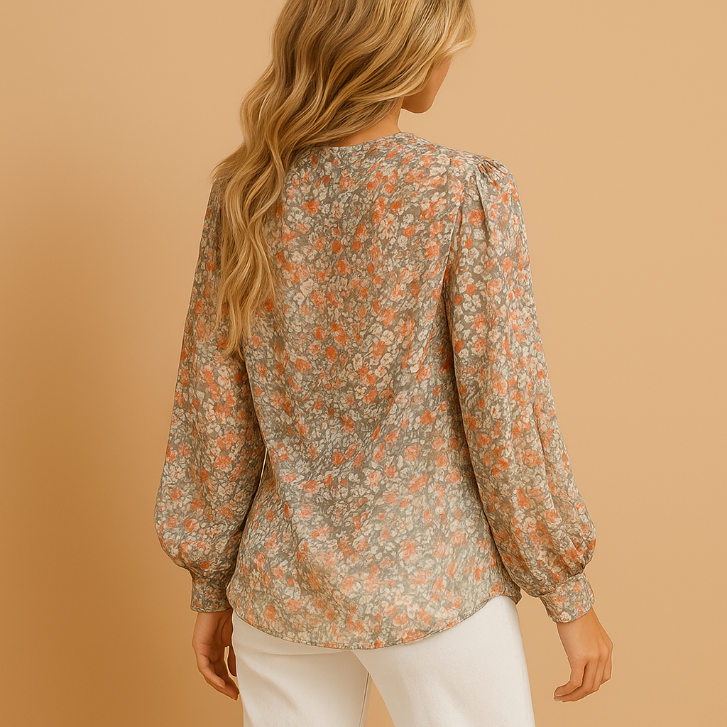 Floral summer blouse for women with long sleeves and a relaxed fit, available in pink, white, and green, perfect for sunny days or chic casual looks.
