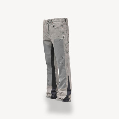 "Front view of men's slim fit stacked jeans in black, gray, blue, showing modern streetwear style and extended leg length."