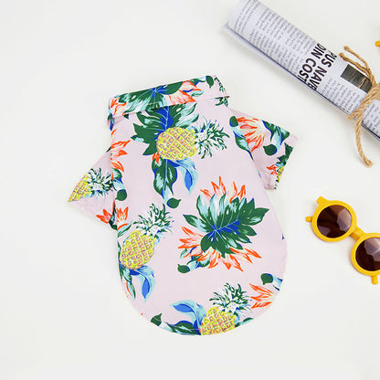 Hawaiian dog shirt with vibrant tropical patterns, featuring pineapples and foliage in bold colors for pet summer style.