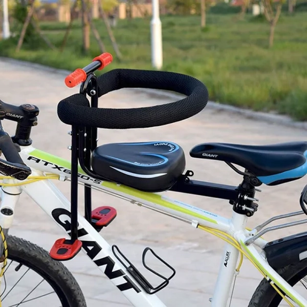 "Kids child bike seat in vibrant red and black with safety harness and padded seat, designed for adult bicycles."